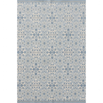 Patterned rug with geometric design in shades of blue on a plain background