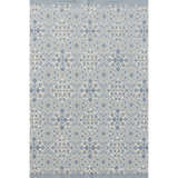 Patterned rug with geometric design in shades of blue on a plain background
