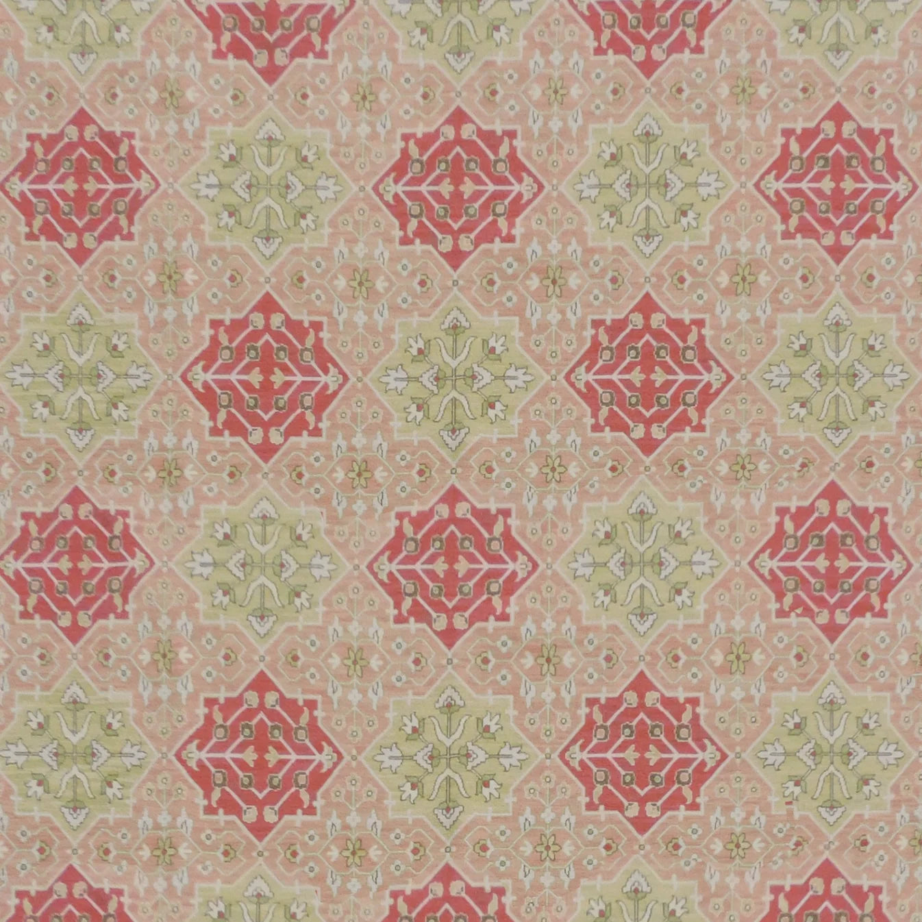 Decorative rug with red and green geometric pattern on a beige background