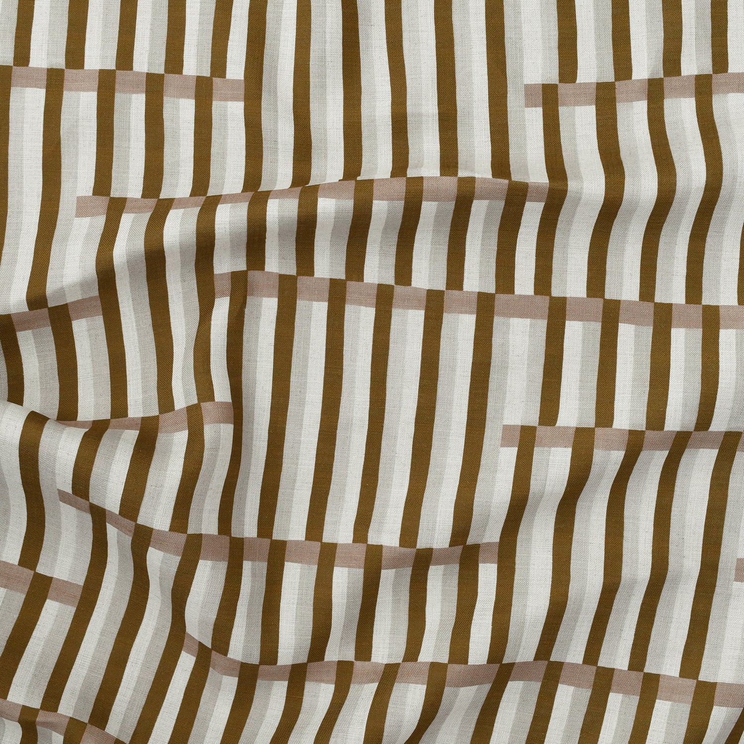 Gently draped printed linen in a broken stripe design in brown, blush pink, ecru and cream. 