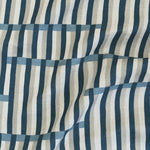 Gently draped printed linen in a broken stripe design in navy, chambray blue, ecru and cream. 