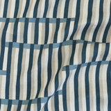 Gently draped printed linen in a broken stripe design in navy, chambray blue, ecru and cream. 