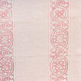 Detail of fabric in a painterly stripe print in shades of pink on a cream field.