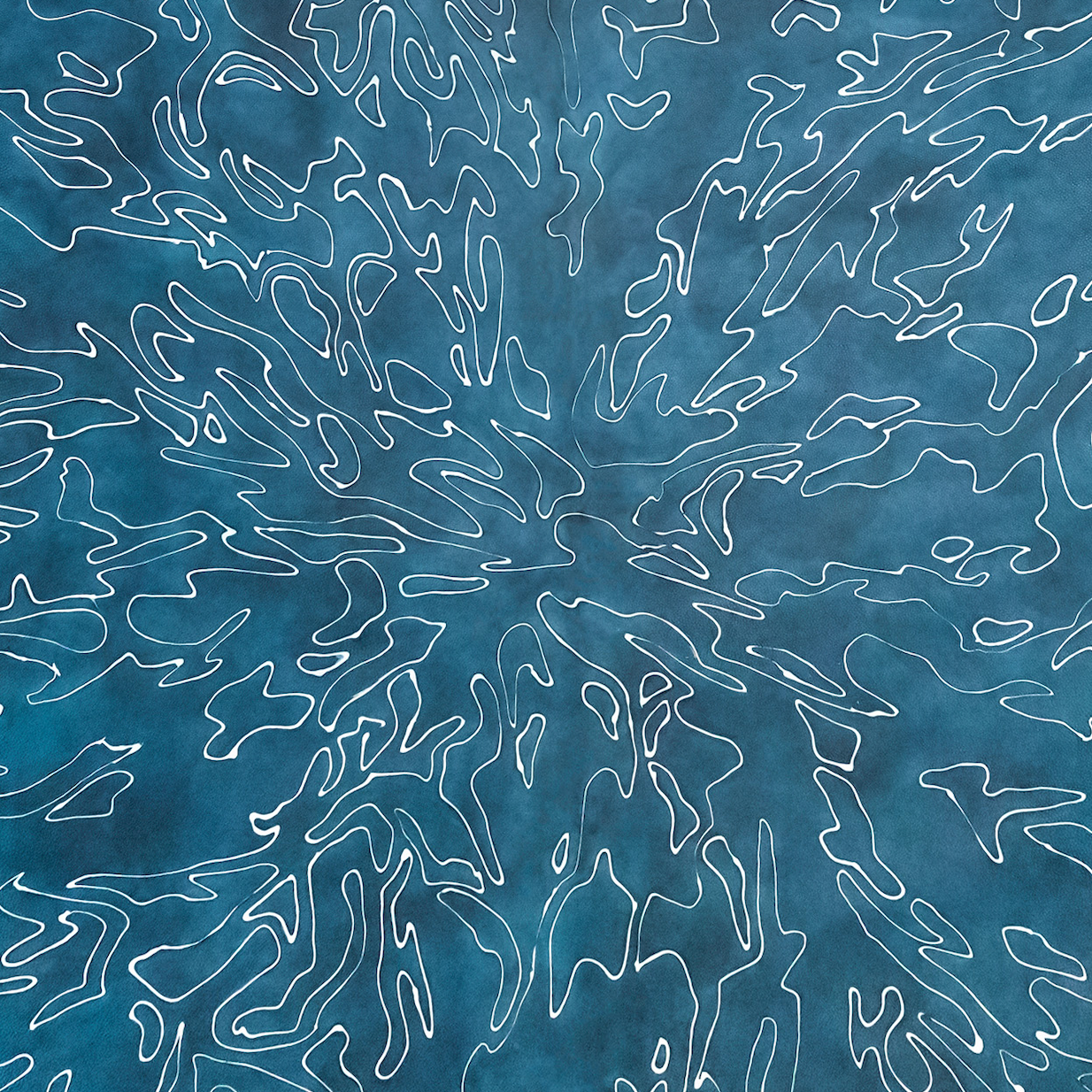 Close-up of a cowhide rug in mottled blue with a white curvilinear overlay.