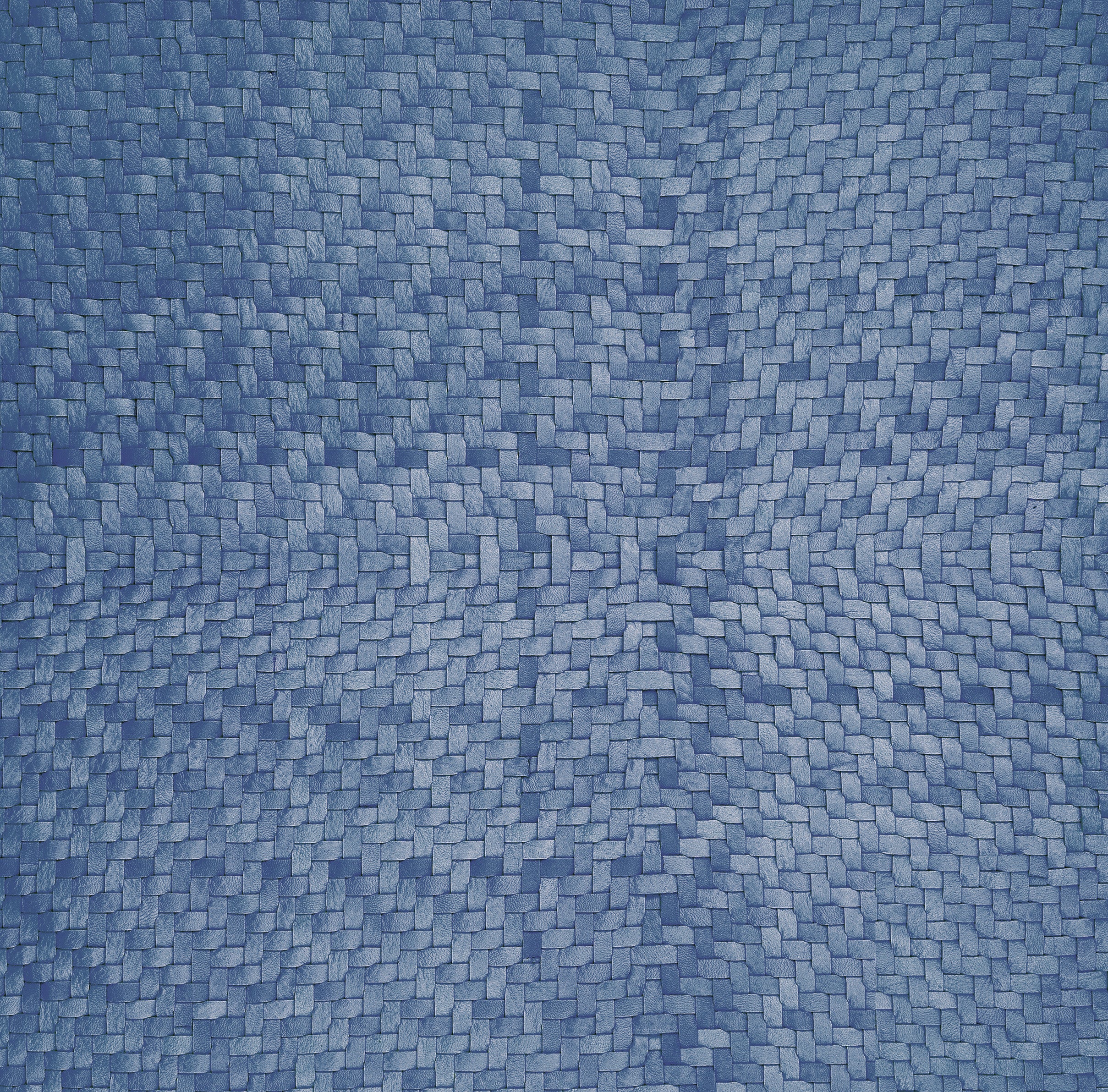 Close-up of blue upholstery leather yardage in a basket weave.