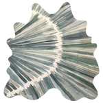 Detail of a cowhide rug in cream with an abstract painterly overlay in shades of green and gray.