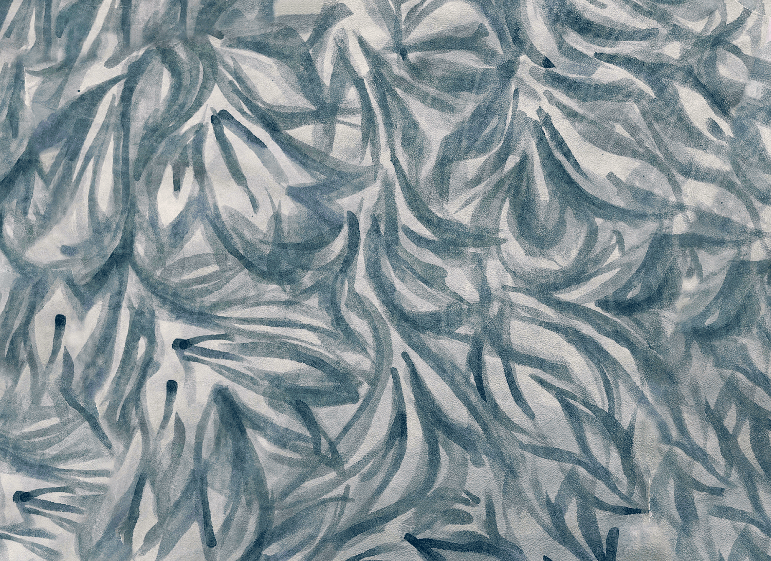 Close-up of a cowhide rug in cream with a painterly botanical overlay in blue and gray.