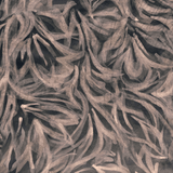 Detail of upholstery leather in black with a painterly botanical overlay in pink.