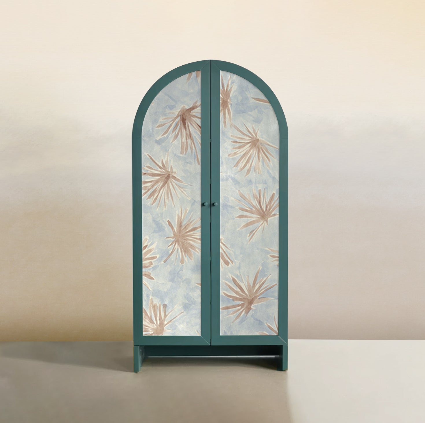 A curvilinear wardrobe with doors upholstered in leather in light blue with a painterly flower print in yellow and coral.