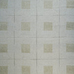 Patterned rug with geometric design on a gray background