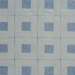 Patterned rug with blue and gray design
