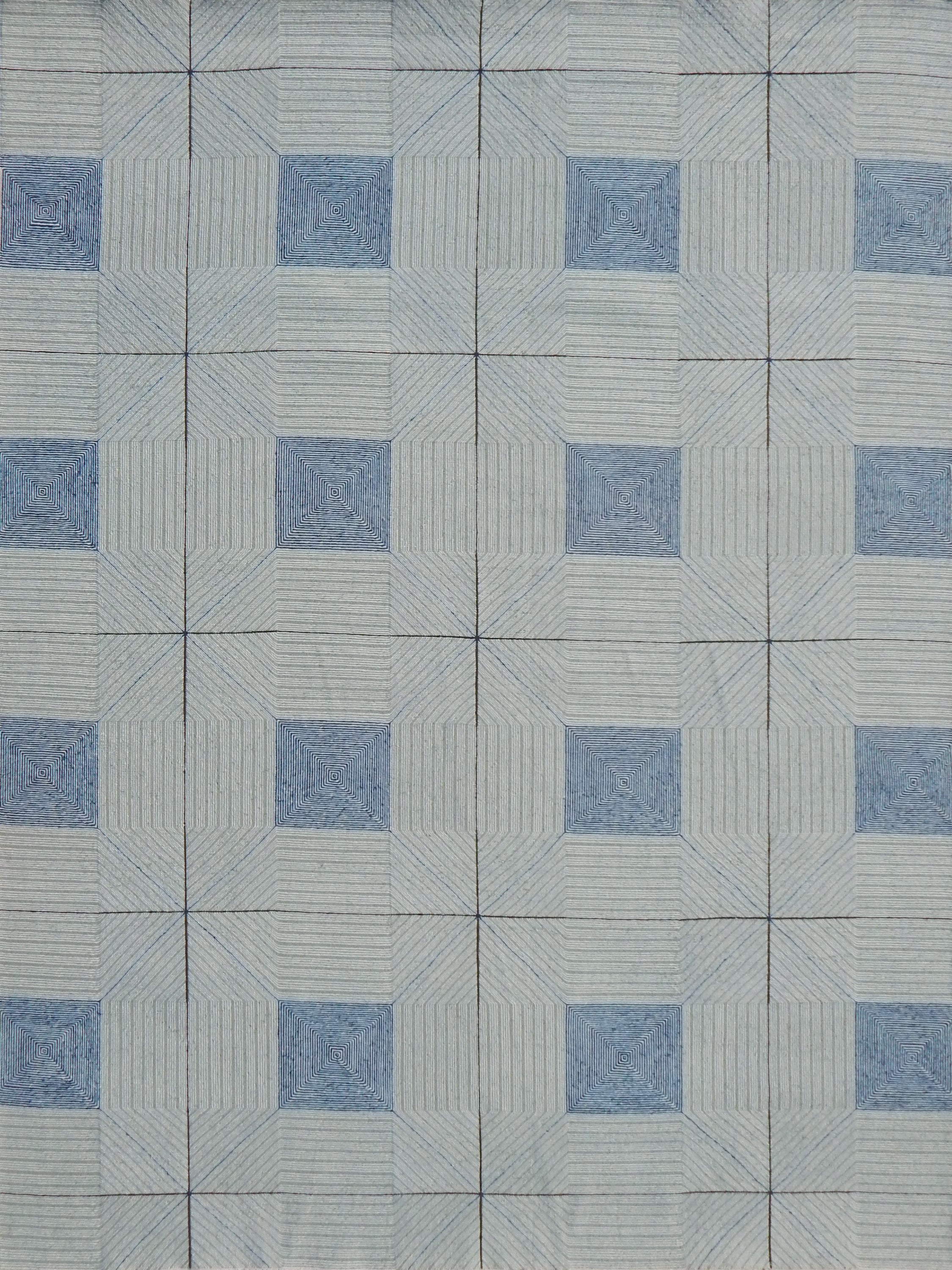 Patterned rug with blue and gray design