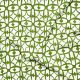 Close up of gently draped fabric with large scale geometric lattice design in white and green.  