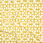 Close up of gently draped fabric with large scale geometric lattice design in white and yellow.
