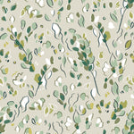 Detail of wallpaper in a painterly leaf print in shades of green and white on a tan field.