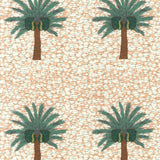 Detail of fabric in a repeating palm tree print on a mottled field in shades of brown, green, light orange and white.