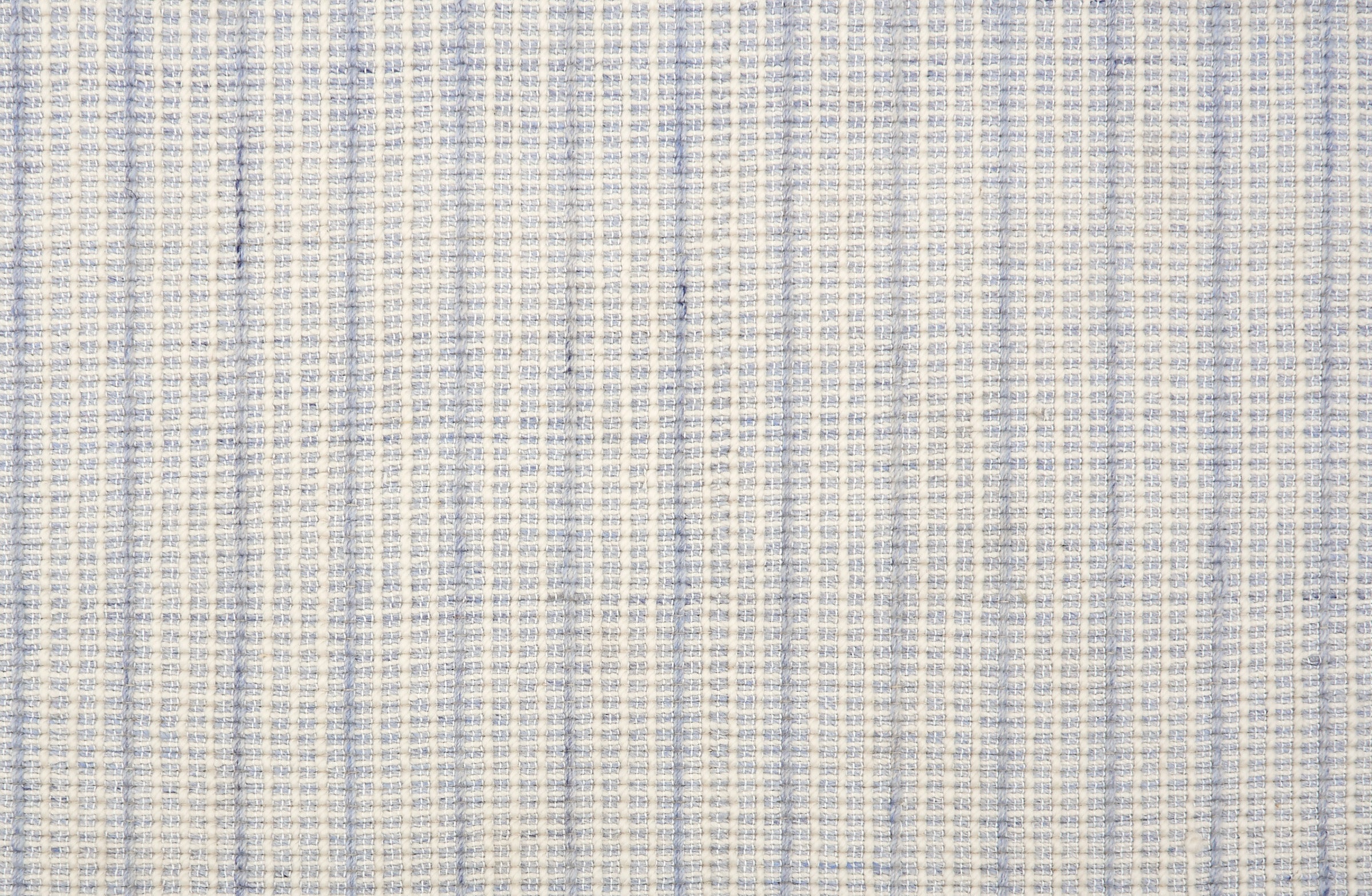 Broadloom carpet in a textural strie stripe in cream with shades of light blue.