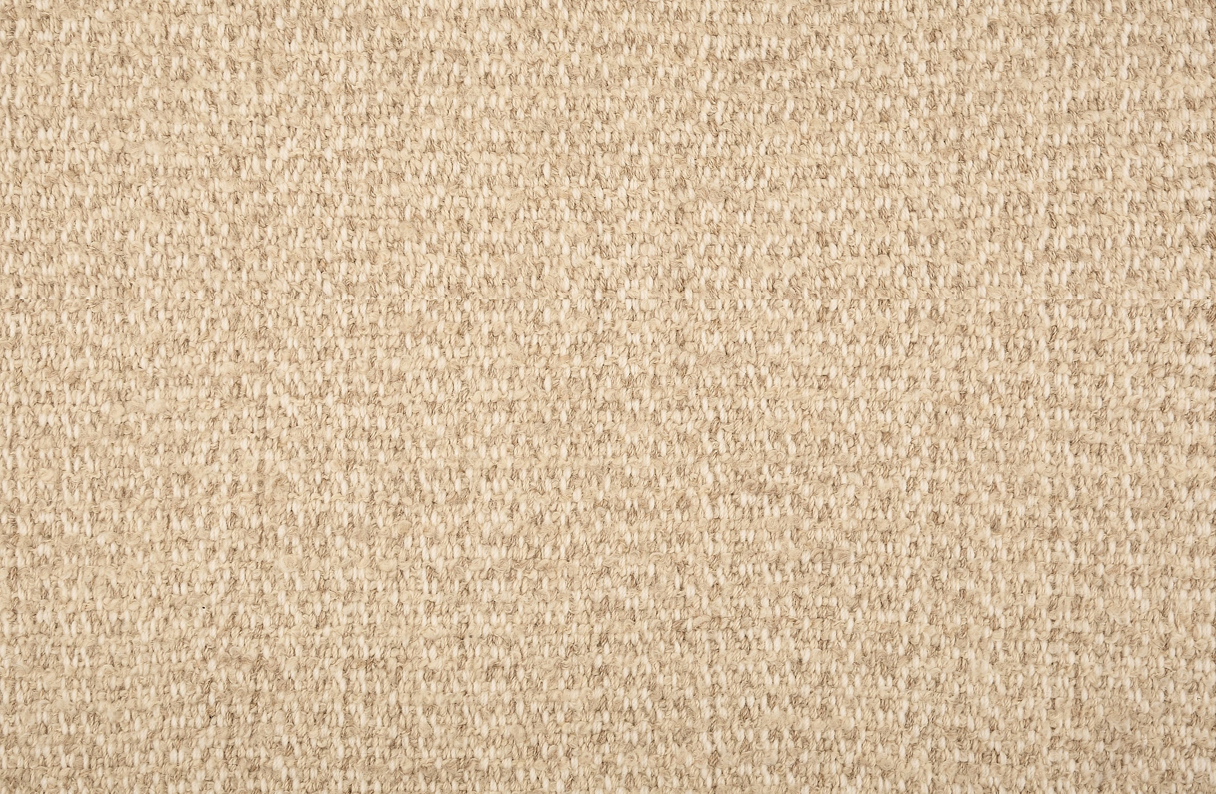 Broadloom carpet in a textural weave in shades of beige. 