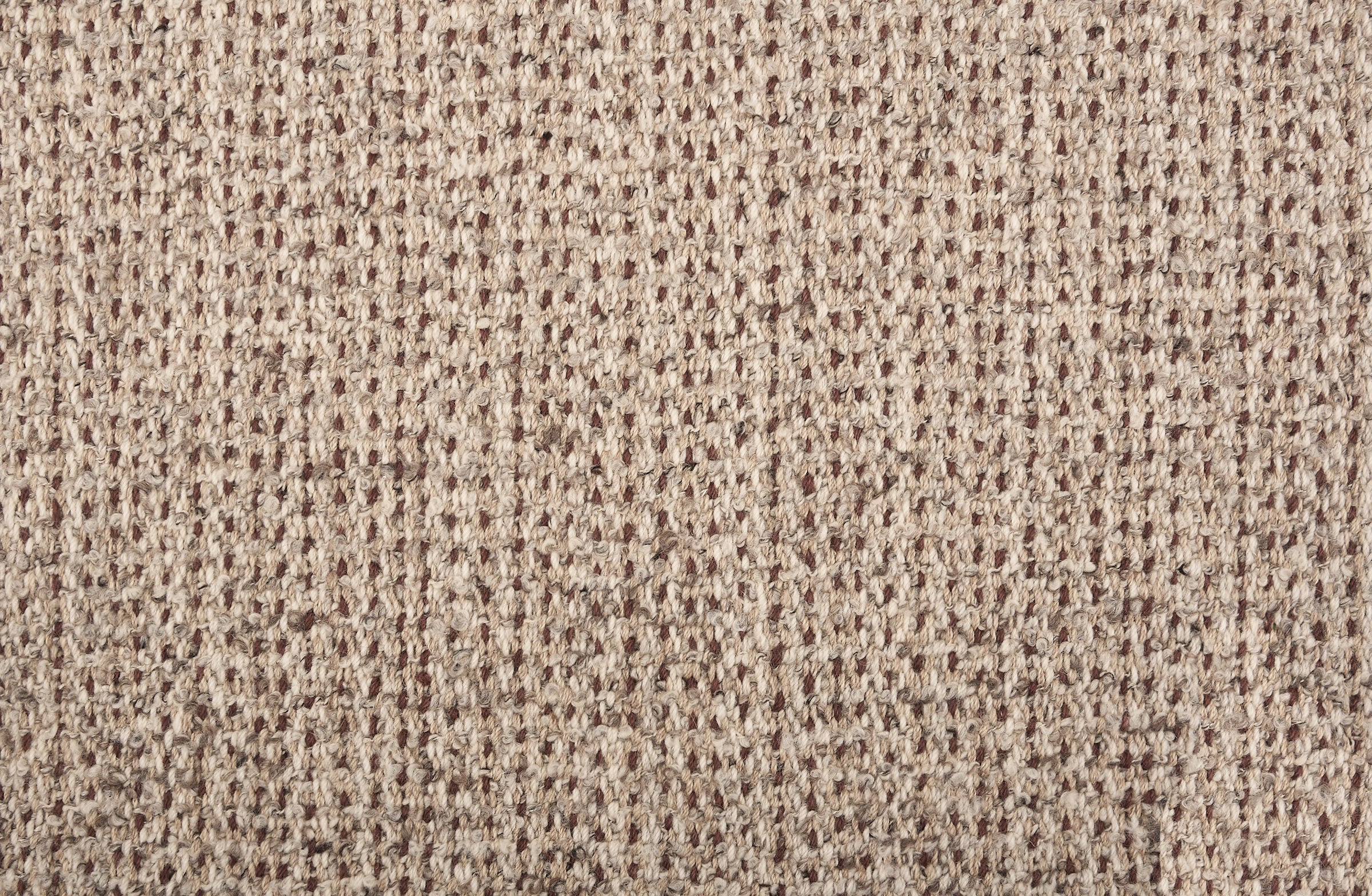 Broadloom carpet in a textural weave in shades of taupe, cream and brown.
