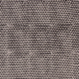 Detail of fabric in a small-scale triangle print in black on a tan field.