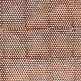 Detail of fabric in a small-scale triangle print in rust on a tan field.