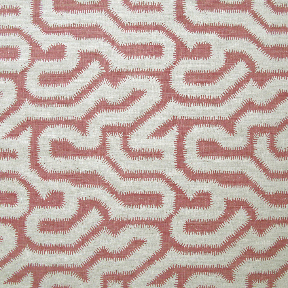 Detail of fabric in a playful meandering print in cream on a dusty rose field.