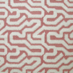Detail of fabric in a playful meandering print in cream on a dusty rose field.