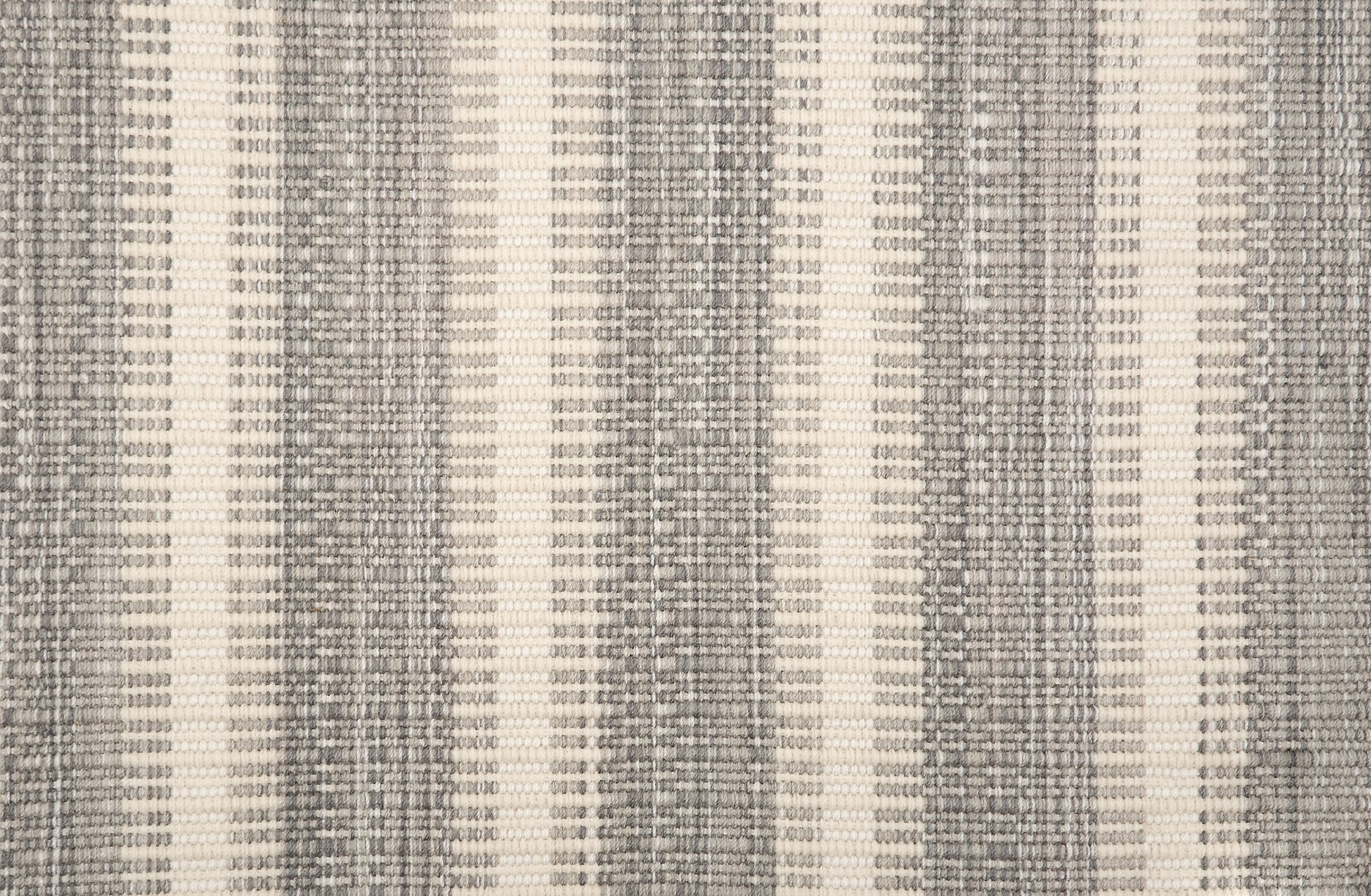 Broadloom carpet in a flatwoven stripe in grey and cream. 