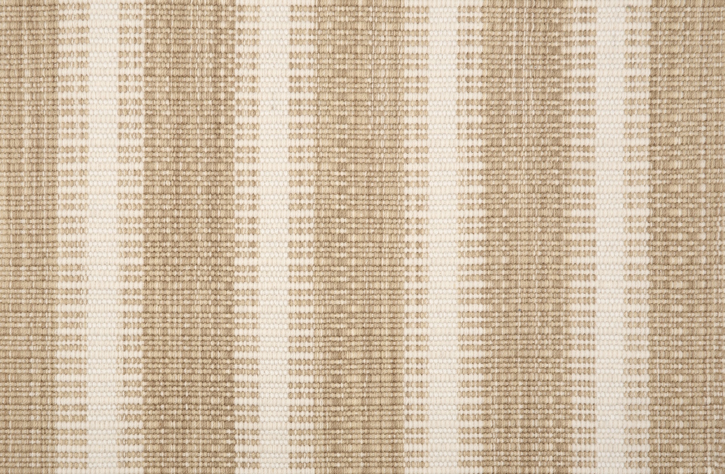 Broadloom carpet in a flatwoven stripe in tan and cream. 