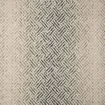 Broadloom with a geometric pattern on an ombré background in cream and emerald green.