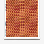 Wallpaper roll with small scale watercolor floral in red and orange.