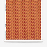 Wallpaper roll with small scale watercolor floral in red and orange.