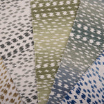 Collection of broadloom carpet swatches in ombré stripe patterns in a range of colors. 