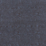 Detail of fabric in a dense paisley print in brown on a navy field.