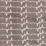 Detail of fabric in an abstract curvilinear stripe in black on a tan field.