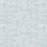 Detail of fabric in a dense herringbone print in blue-gray on a white field.