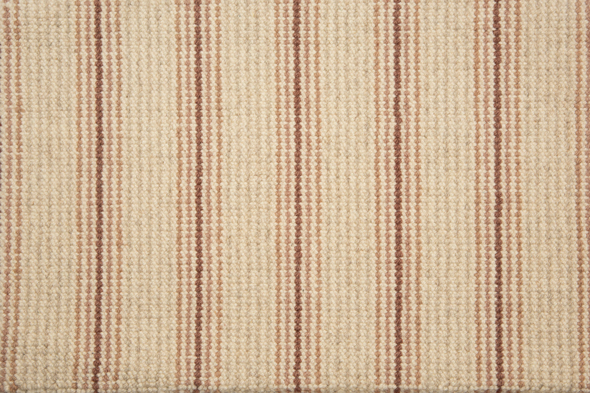 Broadloom carpet with widely spaced pin stripes in  light and dark pink with oatmeal. 