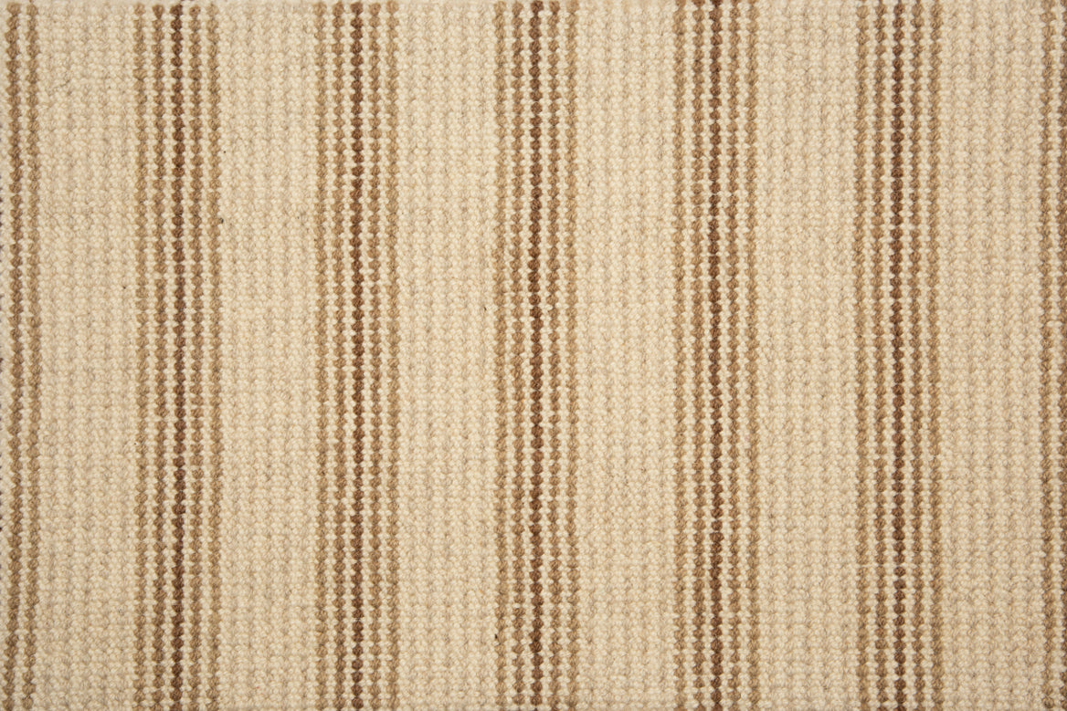 Broadloom carpet with widely spaced pin stripes in tan and brown with oatmeal. 