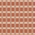 A wallpaper pattern detail in a gridded check pattern in warm pink hues. 