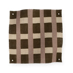 A fabric swatch in a gridded check pattern in brown, cream and mauve. 