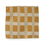 A fabric swatch in a gridded check pattern in shades of ochre yellow