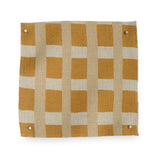 A fabric swatch in a gridded check pattern in shades of ochre yellow