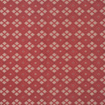 Woven fabric with ornate diamond design with cream accents on red
