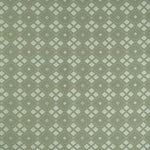 Woven fabric with ornate diamond design in shades of green. 