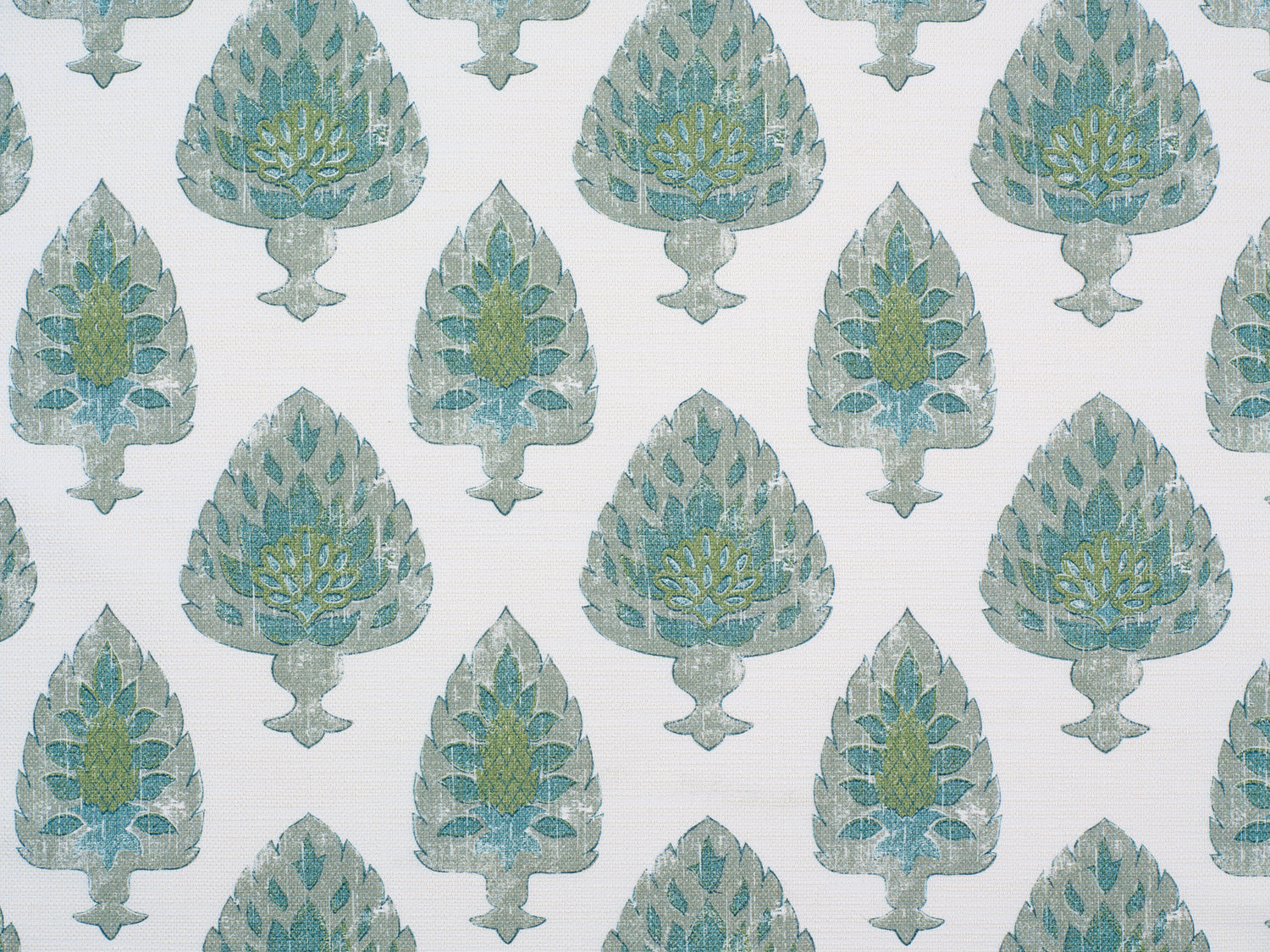 Detail of fabric in a botanical damask print in shades of green and blue on a cream field.