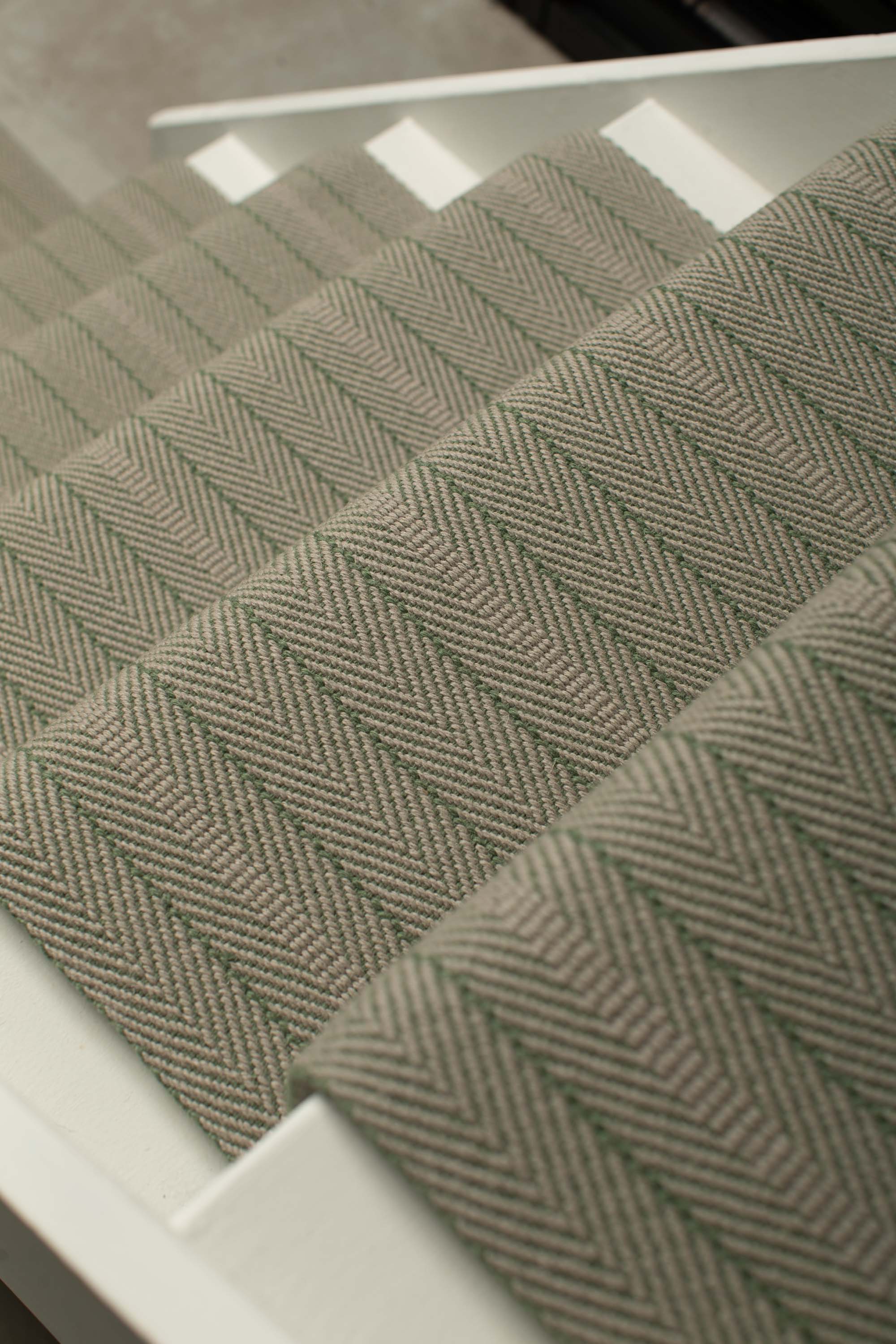 Striped flatweave runner in sage on white staircase