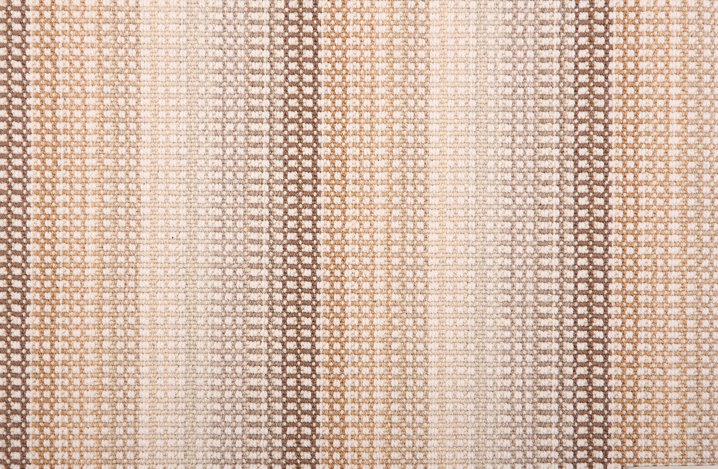 Broadloom carpet in a textural multi color stripe in a palette of neutral tan, brown and cream.