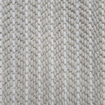 Close-up of a broadloom carpet with vertical stripes in beige and white