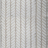 Close-up of a broadloom carpet with vertical stripes in beige and tan