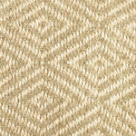 Close-up of a textured natural fibre woven diamond pattern rug in beige. 